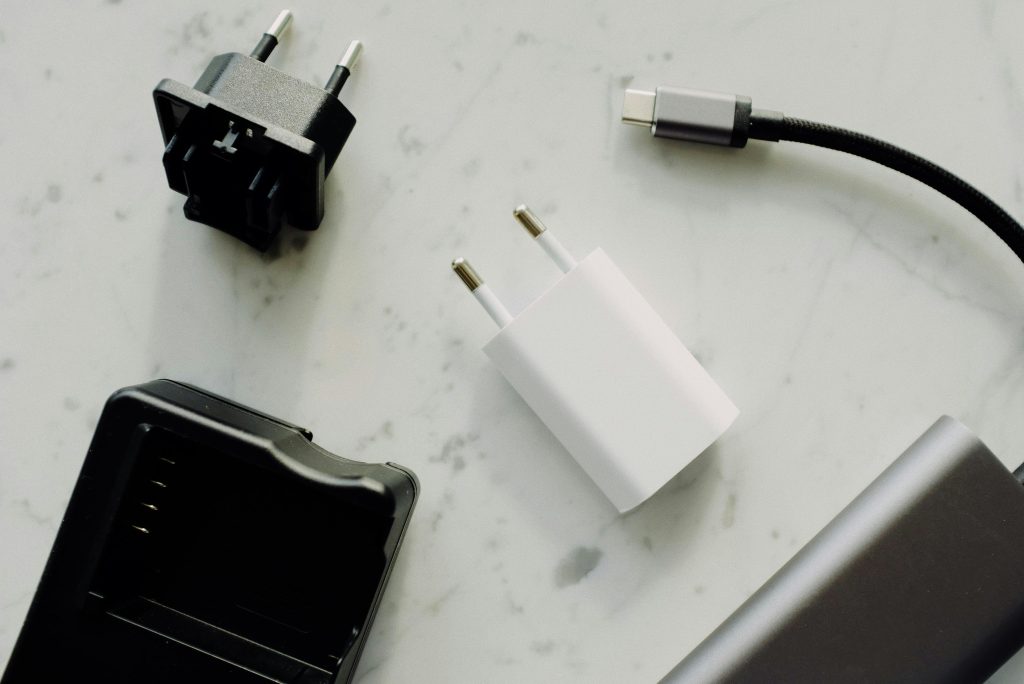 pexels photo 3921630 3921630 Close-up of USB-C and adaptors on a marble surface, highlighting modern electronics essentials.
