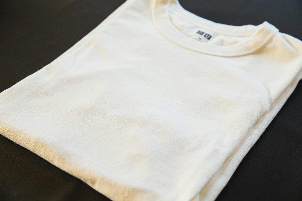 pexels photo 5746087 5746087 High angle of classic new male t shirt with tag and round shaped neckline