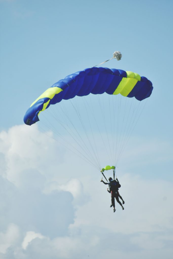 pexels photo 2379020 2379020 Tandem skydiving experience captured mid-air against a clear sky.